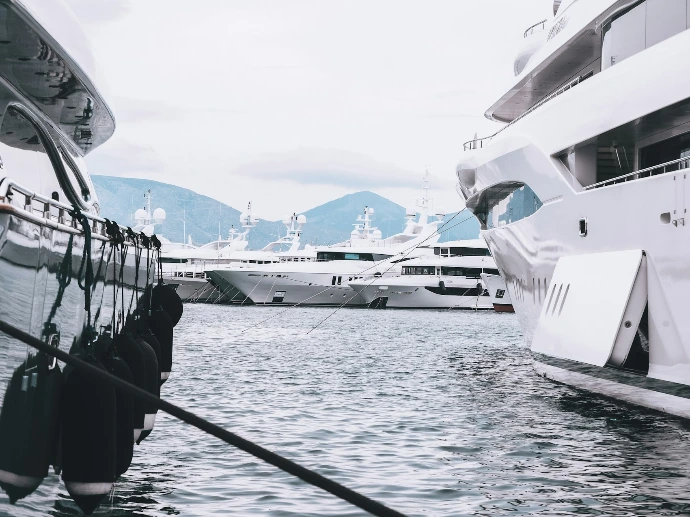 white yacht on dock during daytime